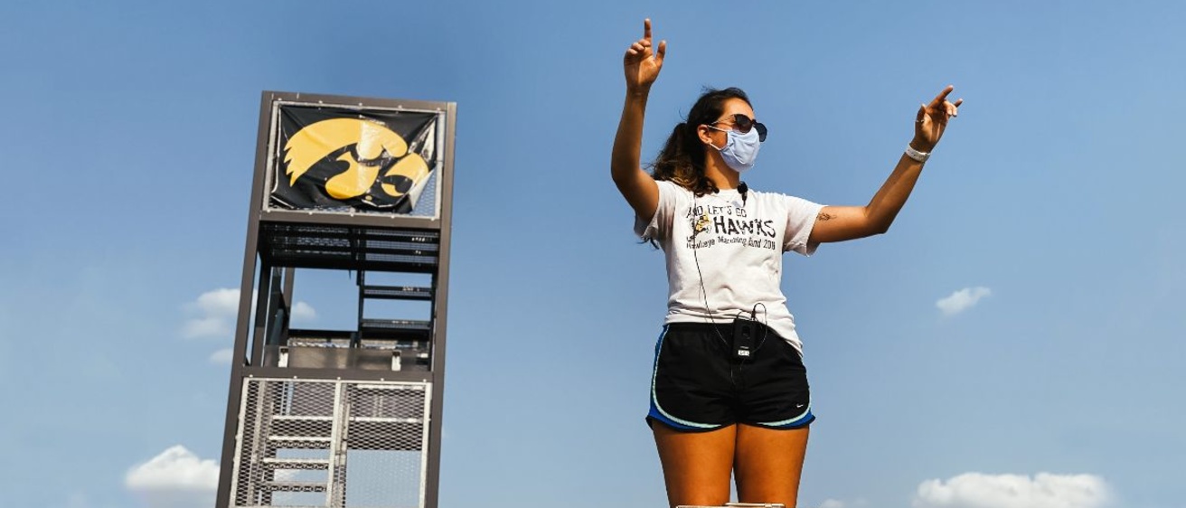 Band Manager Kate Weldon conducting the Hawkeye Marching Band