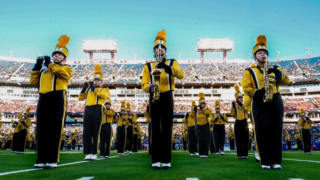 Band performing in a football stadium