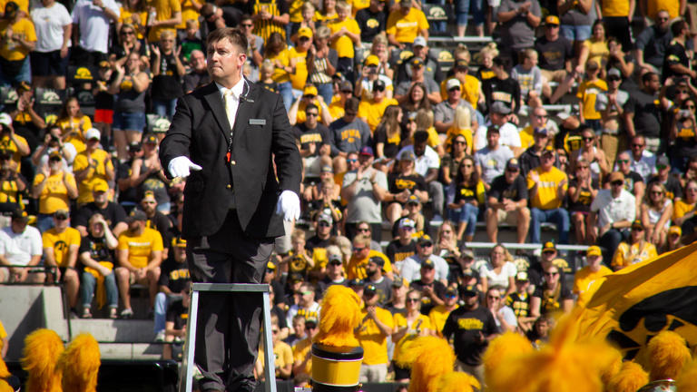 Graduate Teaching Assistant conducting the Hawkeye Marching Band
